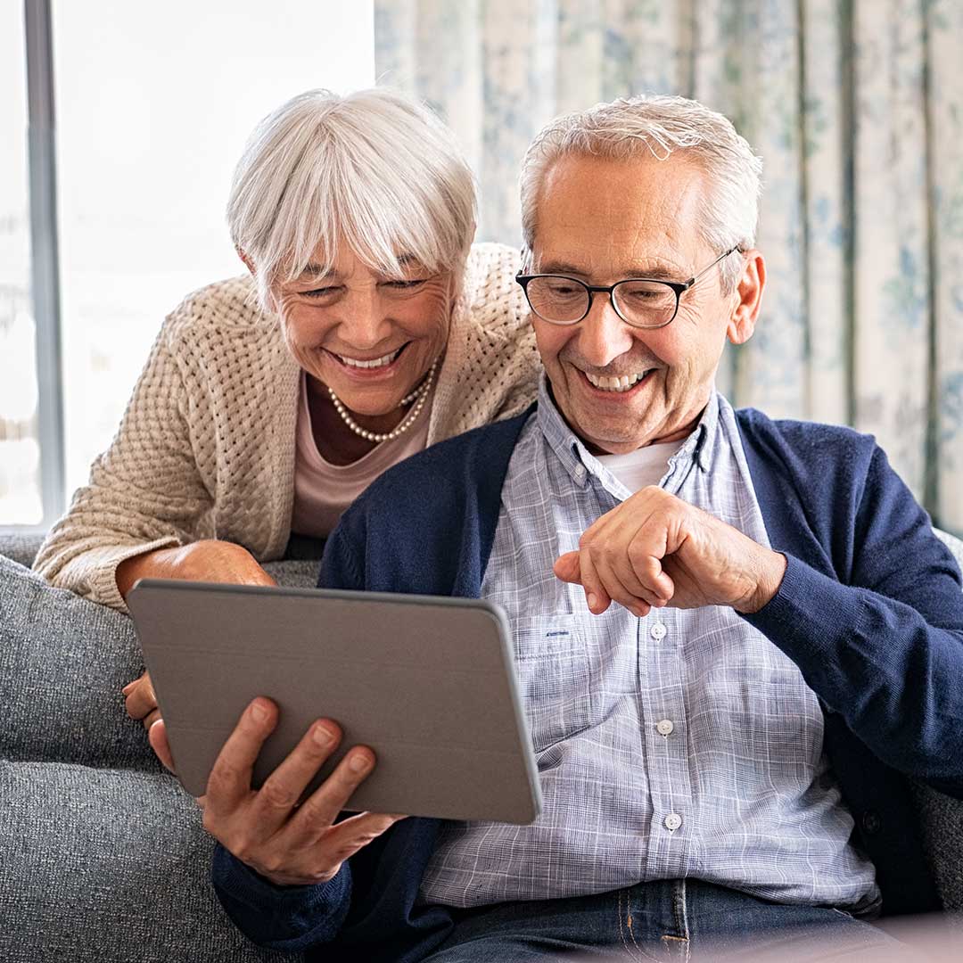 older couple looking at a tablet